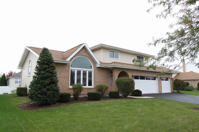 317 Highland Road Matteson, IL 60443 - Photo 1 of 1 a view of a yard in front of a house with plants and large tree