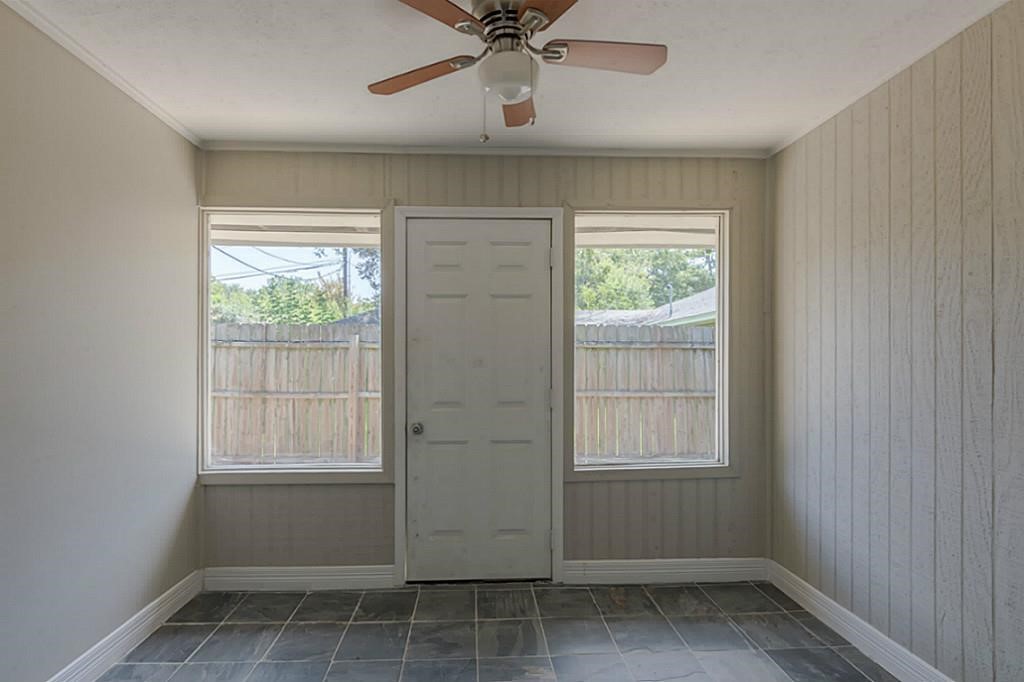 6514 Reamer Street Houston, TX 77074 - Photo 14 of 19 an empty room with windows and fan