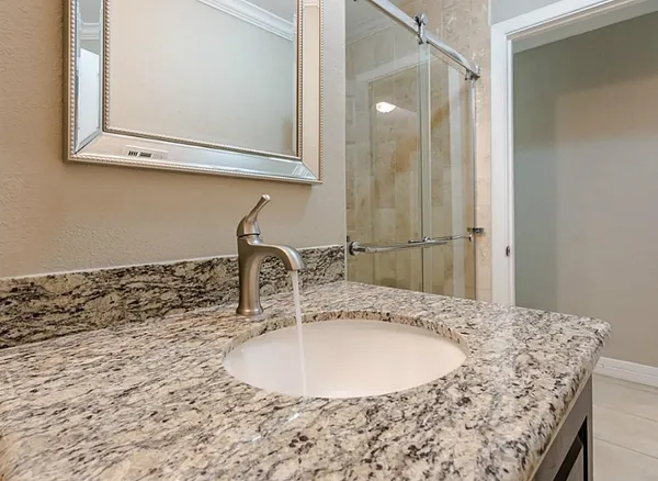 a bathroom with a sink and a mirror