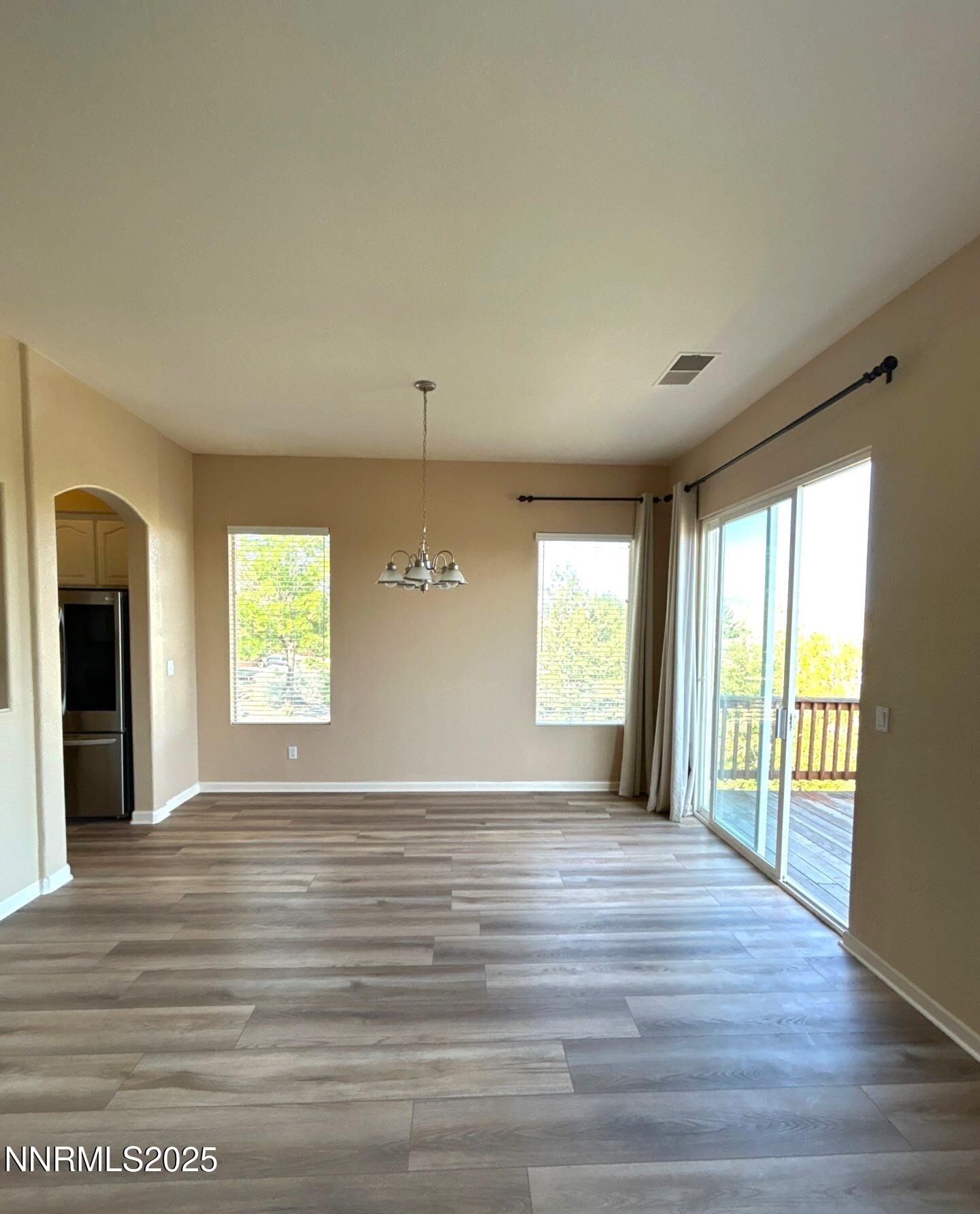 1484 Cloud Peak Drive Sparks, NV 89436 - Photo 5 of 16 a view of empty room with wooden floor and fan