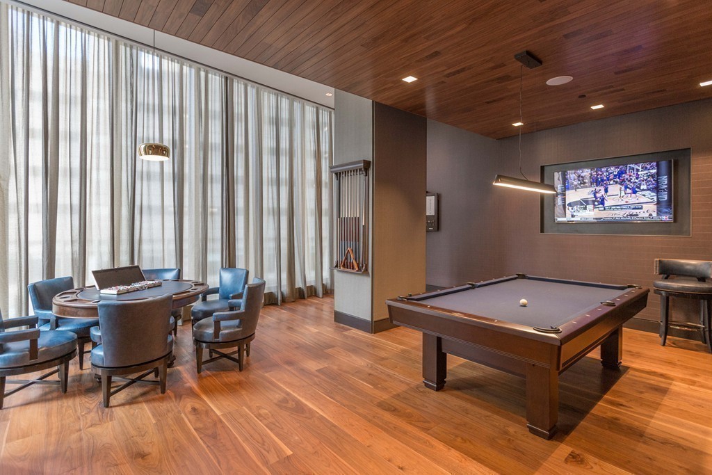 1 Franklin Street, Unit 1004 Boston, MA 02110 - Photo 19 of 24 a living room with furniture a piano and a window