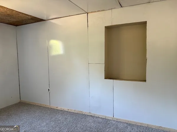 a bathroom with a shower and a mirror