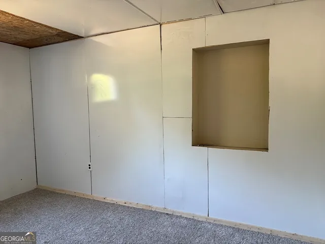 a bathroom with a shower and a mirror