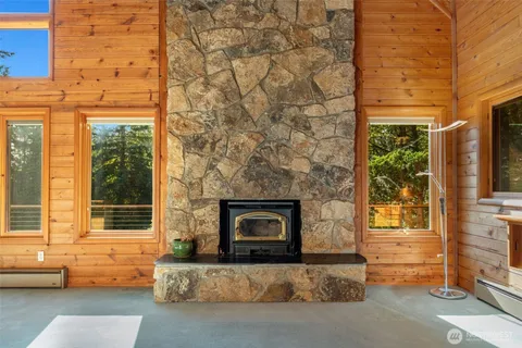 a living room with a fireplace in front of it