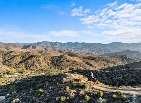 a view of mountain view with mountains in the background