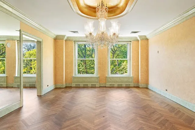 a view of a hallway with wooden shelves