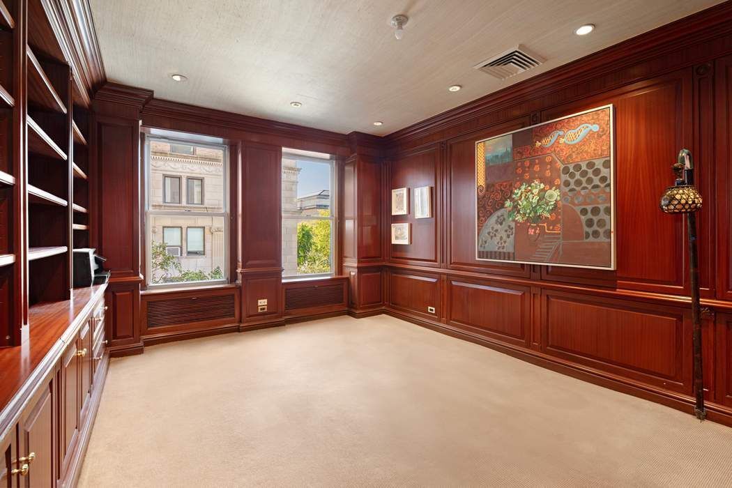 1040 5th Avenue, Unit 3A Manhattan, NY 10028 - Photo 7 of 16 a living room with furniture and large windows