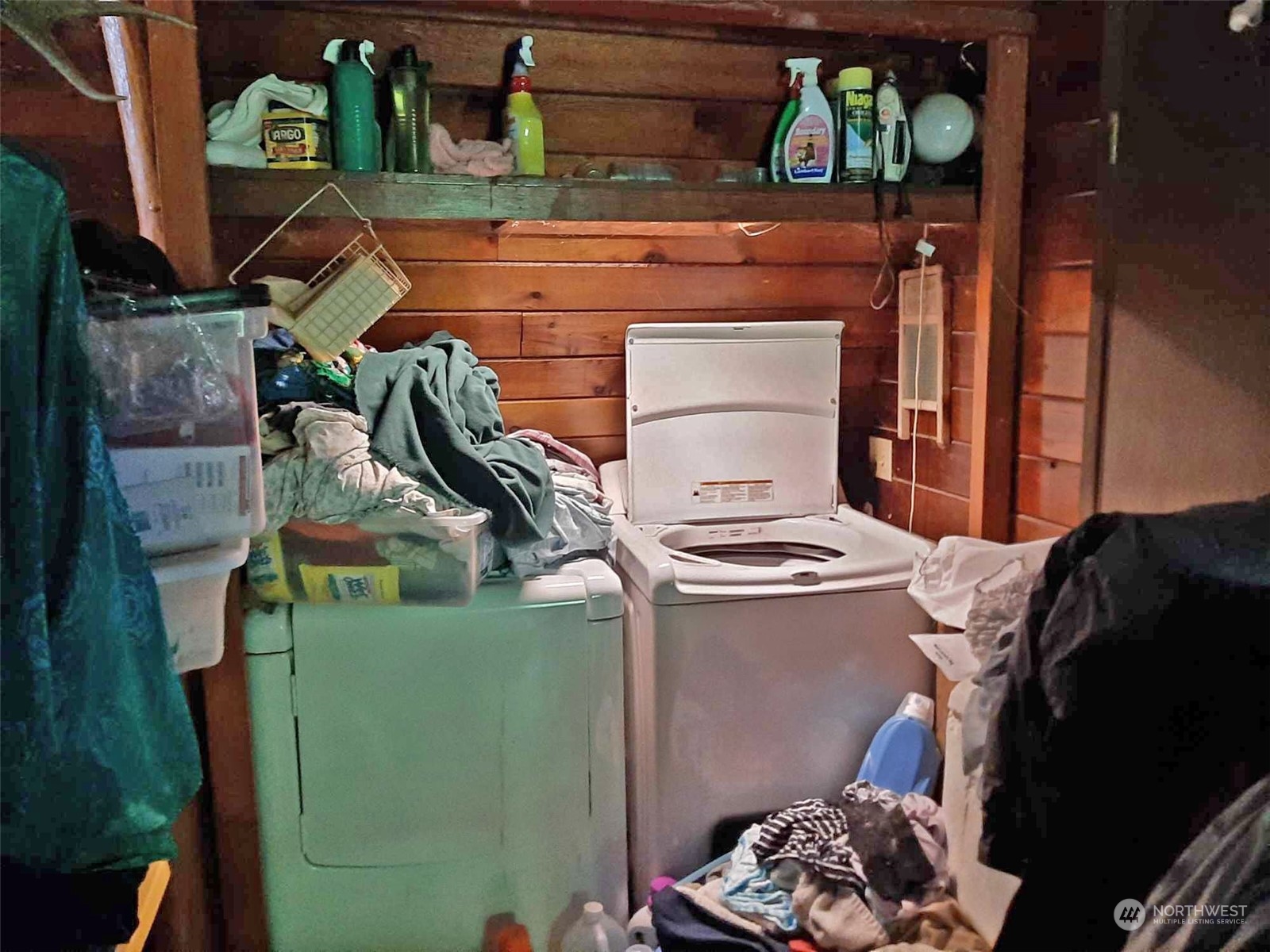 10 McKee Road Quilcene, WA 98376 - Photo 11 of 34 a bed room with a bed and a painting on the wall