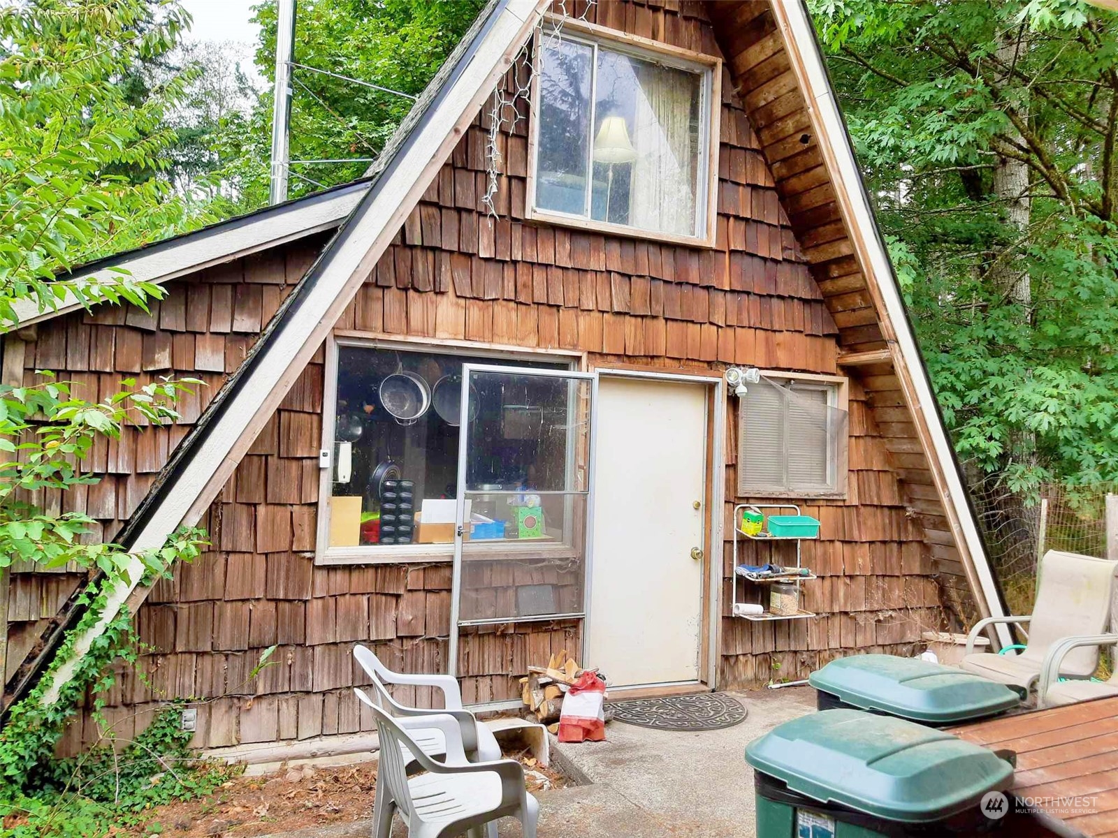 10 McKee Road Quilcene, WA 98376 - Photo 2 of 34 a view of sitting area with swimming pool