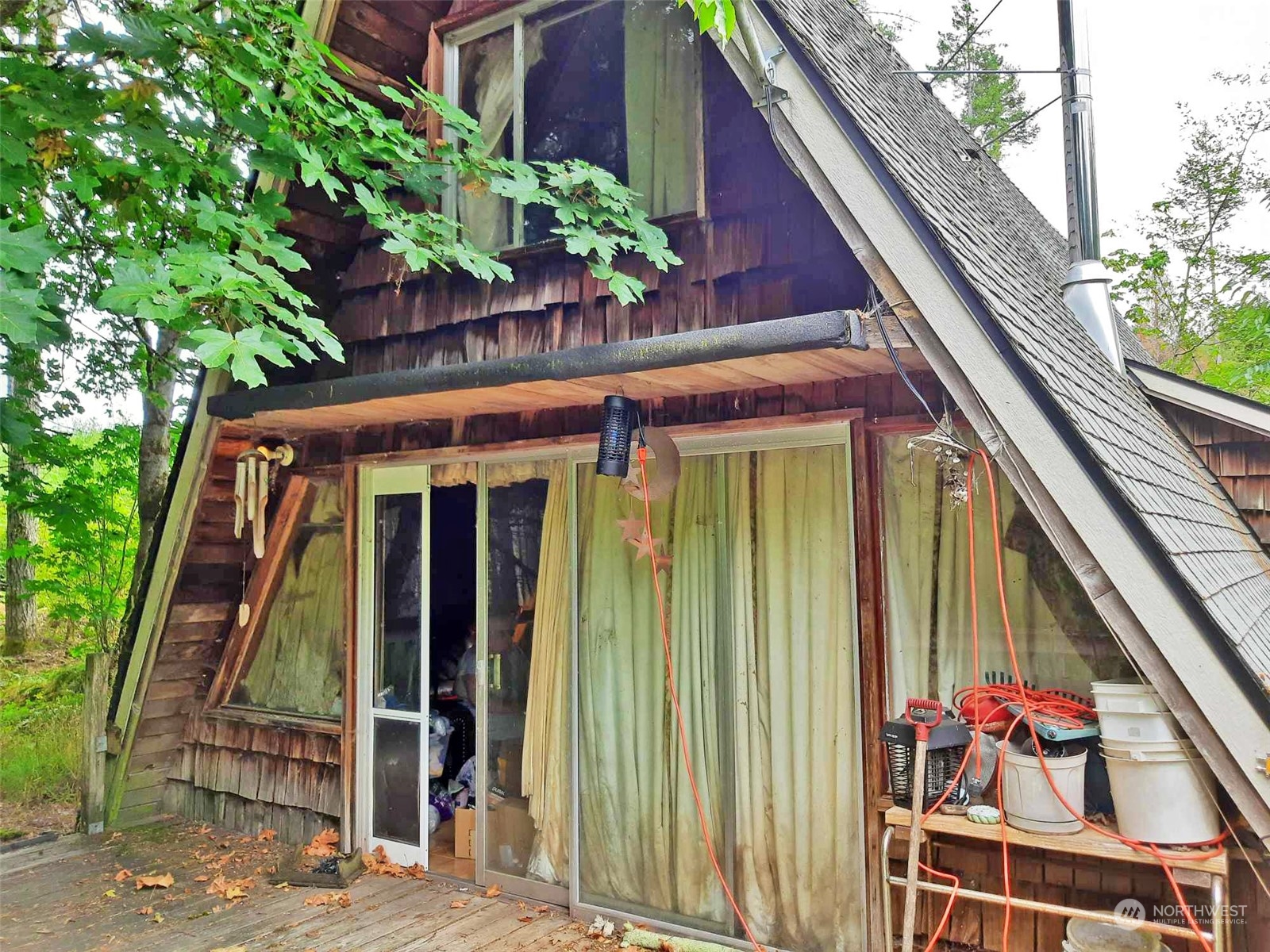 10 McKee Road Quilcene, WA 98376 - Photo 4 of 34 a front view of a house with a garden