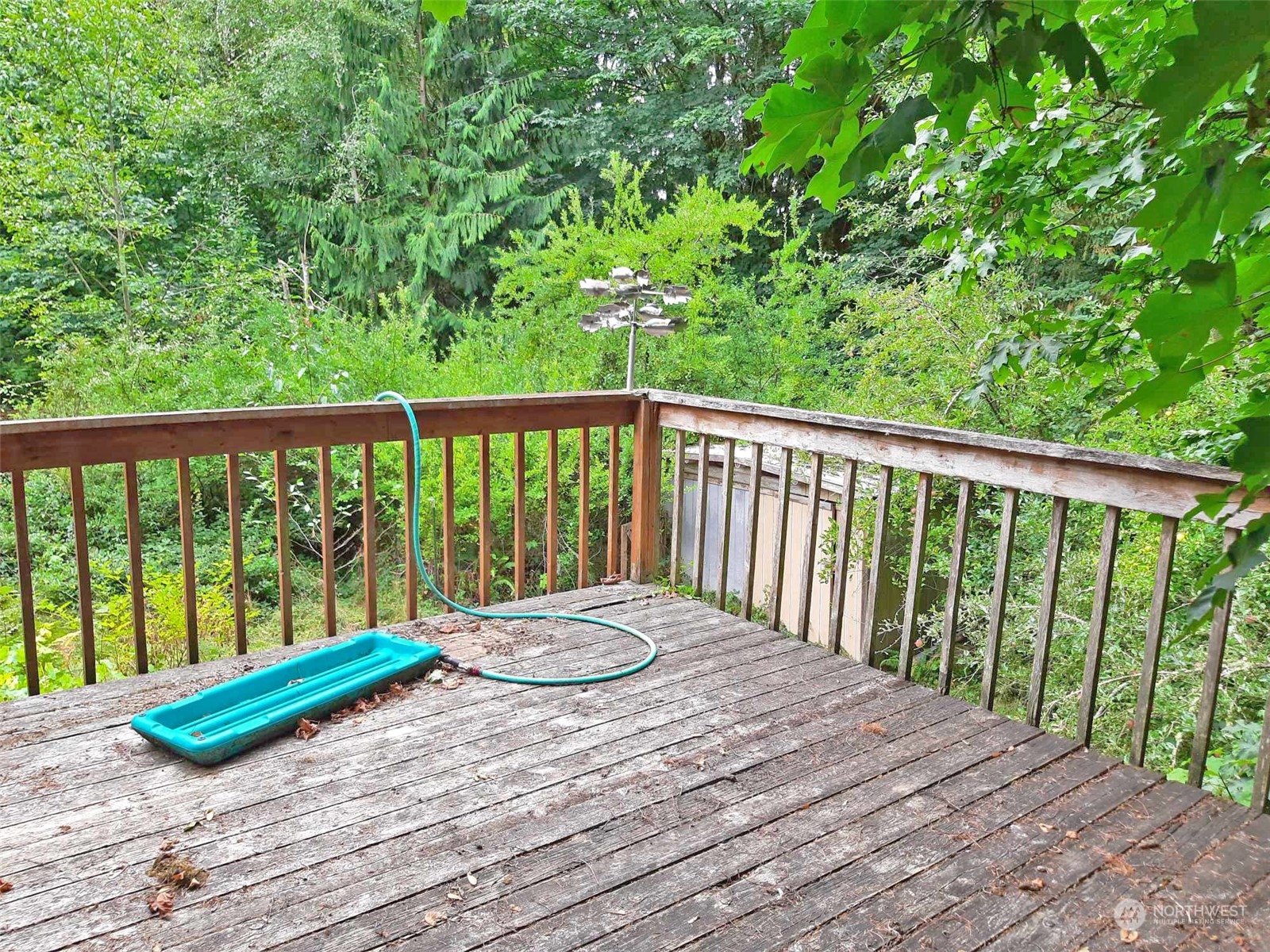 10 McKee Road Quilcene, WA 98376 - Photo 6 of 34 a view of balcony with wooden floor and fence