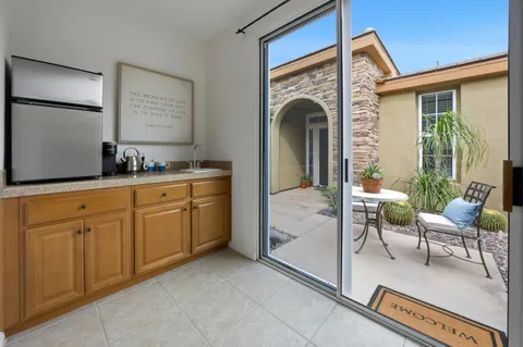 a view of living room with furniture and a fireplace