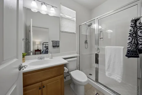a bathroom with a sink toilet and shower