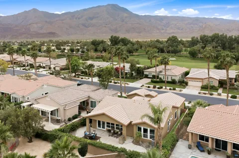 an aerial view of residential houses and outdoor space
