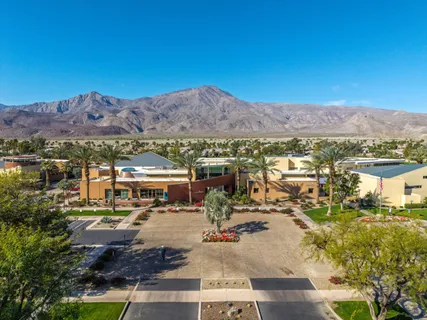 a view of a city with mountains in the background