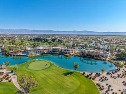 a view of a swimming pool and an outdoor seating