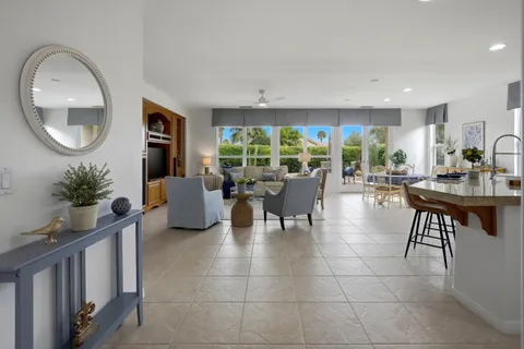 a lobby with furniture and a potted plant