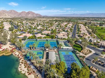 an aerial view of residential building and lake