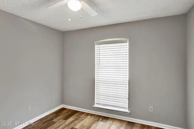 a view of a room that has a window in it