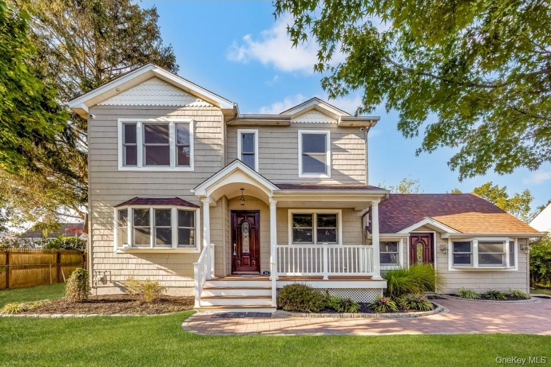 31 Fuller Avenue West Babylon, NY 11704 - Photo 1 of 33 a front view of a house with a yard
