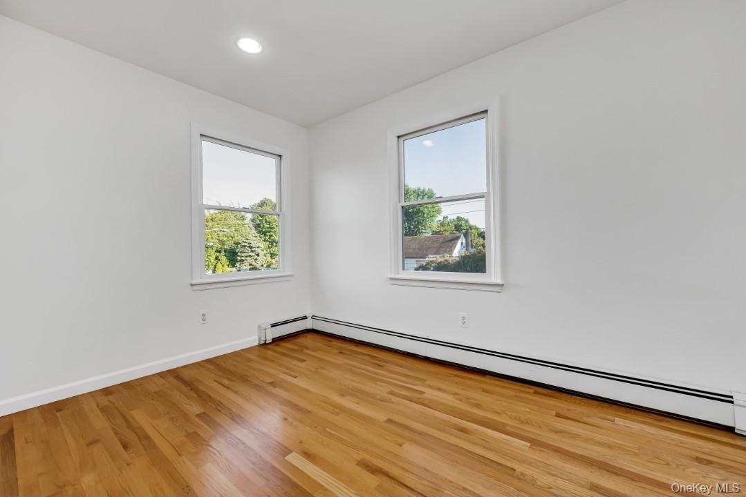 31 Fuller Avenue West Babylon, NY 11704 - Photo 22 of 33 an empty room with window