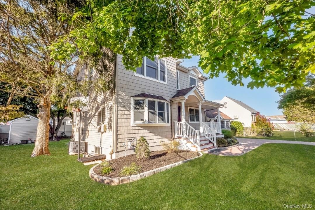 31 Fuller Avenue West Babylon, NY 11704 - Photo 3 of 33 a front view of a house with a yard