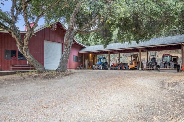 a front view of a house with lots of green space