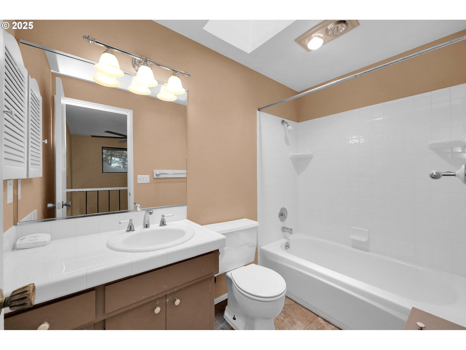 4103 Brae Burn Drive Eugene, OR 97405 - Photo 18 of 22 a bathroom with a sink a toilet a mirror and shower