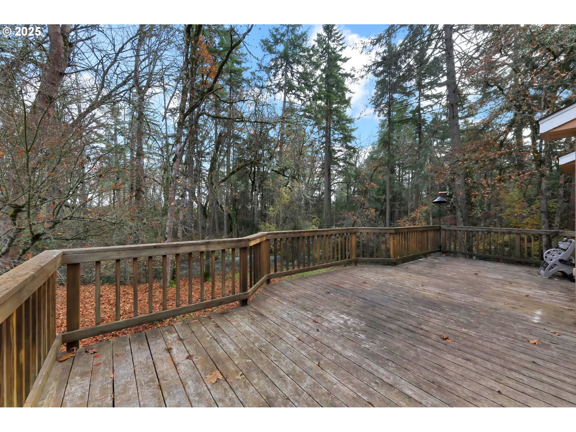 4103 Brae Burn Drive Eugene, OR 97405 - Photo 19 of 22 a view of deck with wooden floor and trees