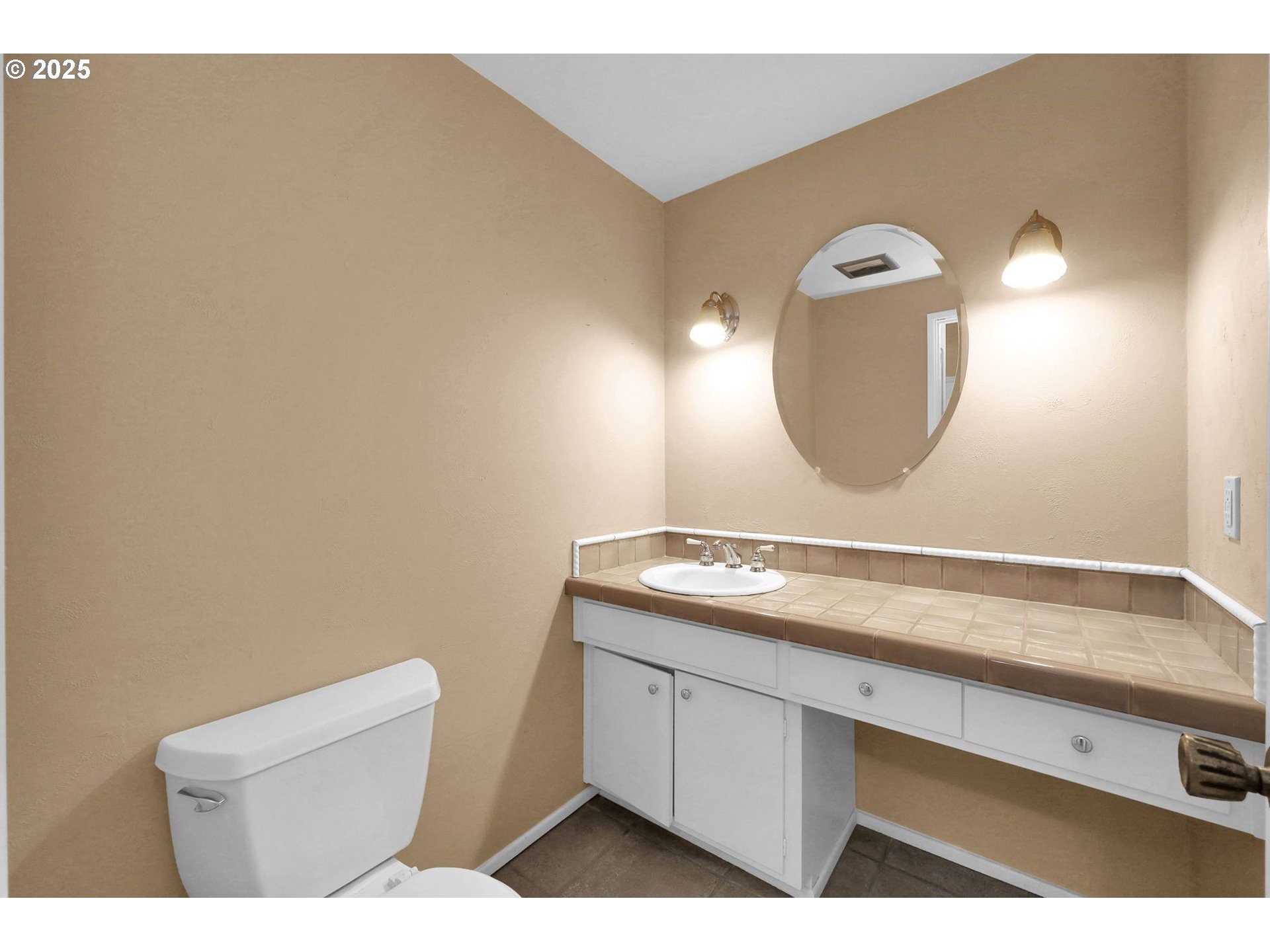 4103 Brae Burn Drive Eugene, OR 97405 - Photo 4 of 22 a bathroom with a sink and a mirror