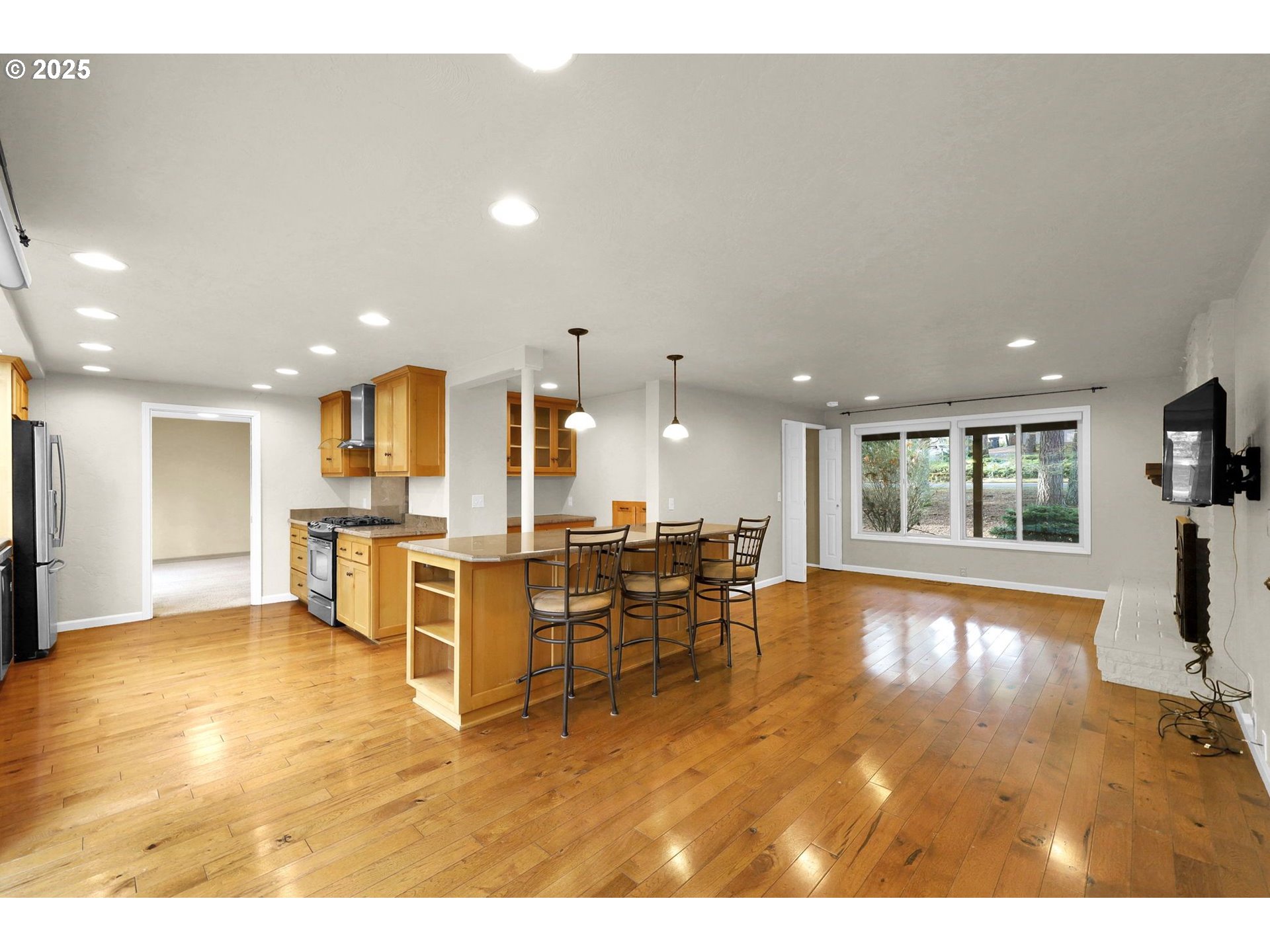 4103 Brae Burn Drive Eugene, OR 97405 - Photo 8 of 22 a living room with lots of furniture and kitchen view