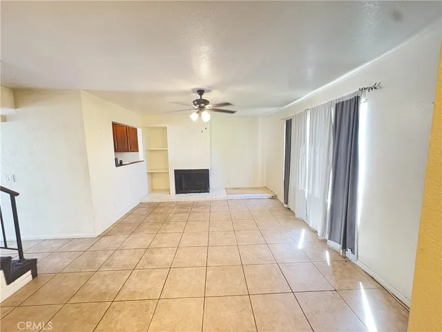 a view of an empty room with glass door