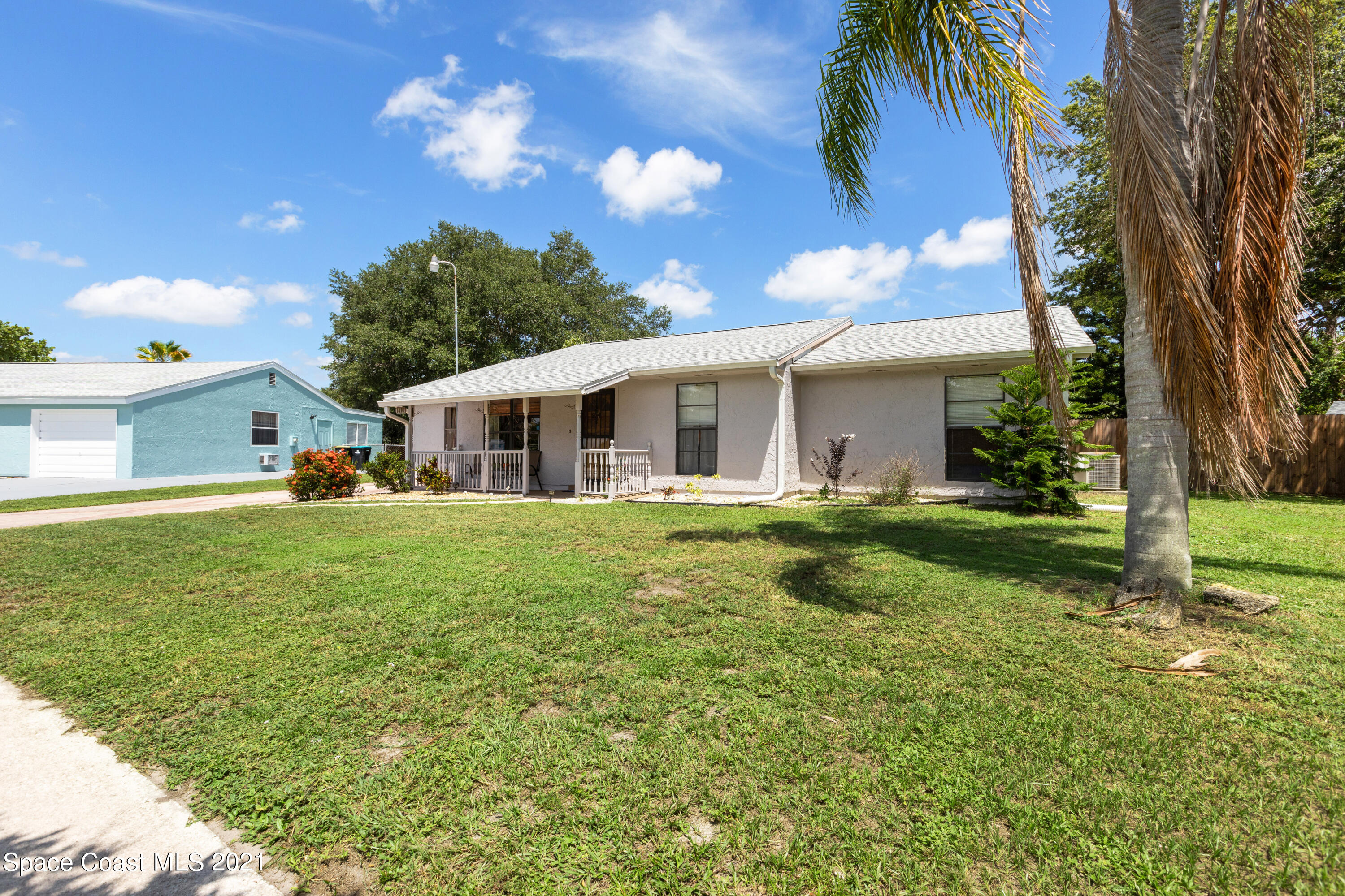 1410 Creel Road Northeast Palm Bay, FL 32905 - Photo 3 of 39 a front view of house with yard and green space