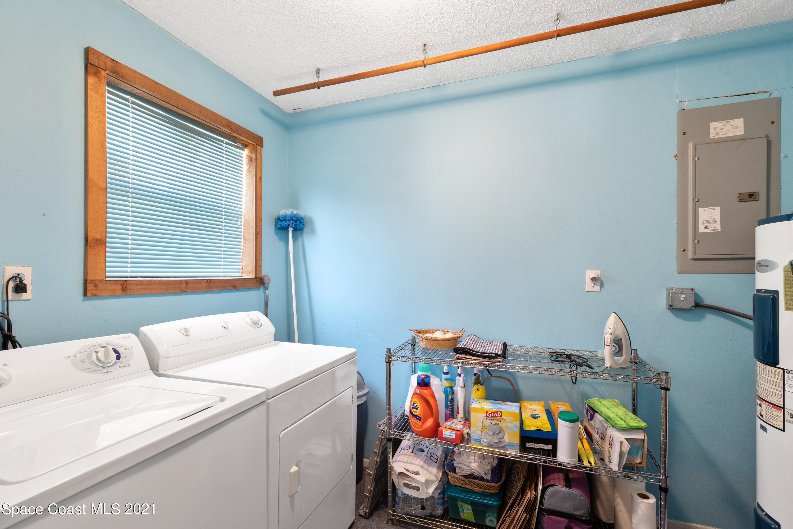 1410 Creel Road Northeast Palm Bay, FL 32905 - Photo 27 of 39 a utility room with dryer and washer