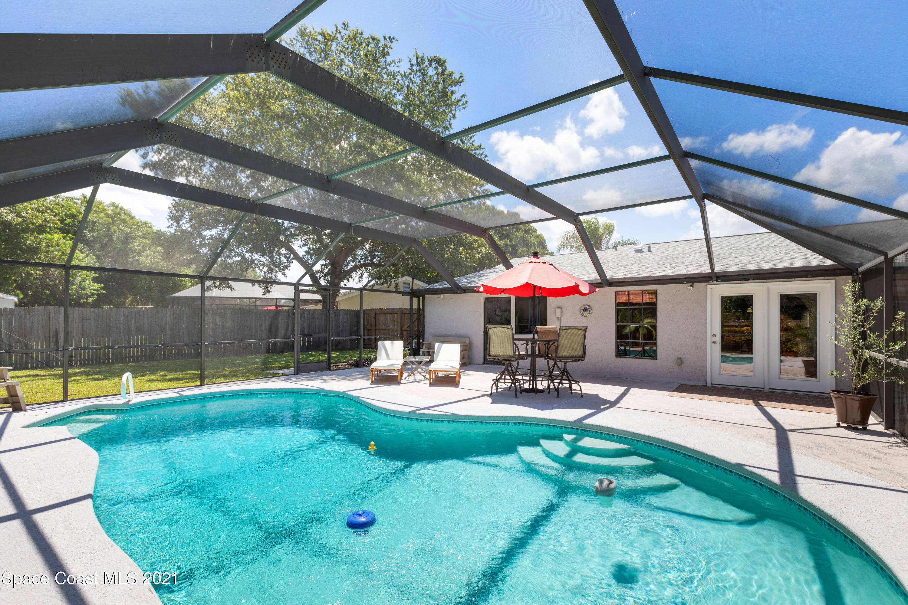 1410 Creel Road Northeast Palm Bay, FL 32905 - Photo 33 of 39 a outdoor space with patio lots of furniture and garden