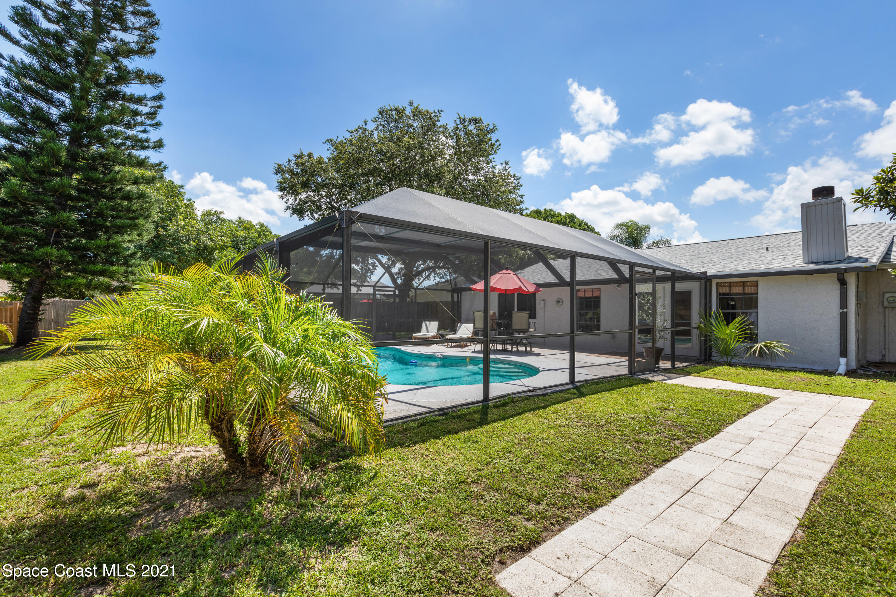 1410 Creel Road Northeast Palm Bay, FL 32905 - Photo 36 of 39 a view of a house with a yard