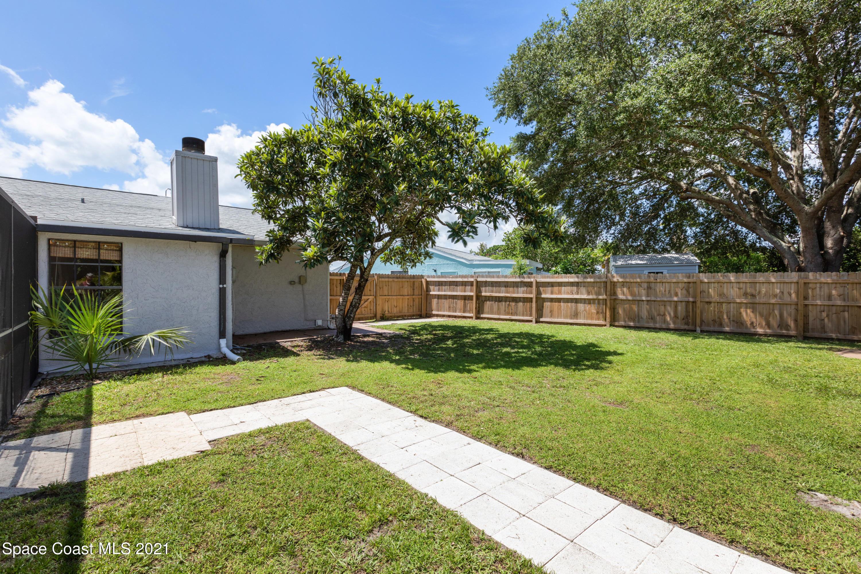 1410 Creel Road Northeast Palm Bay, FL 32905 - Photo 37 of 39 a view of a backyard with a garden
