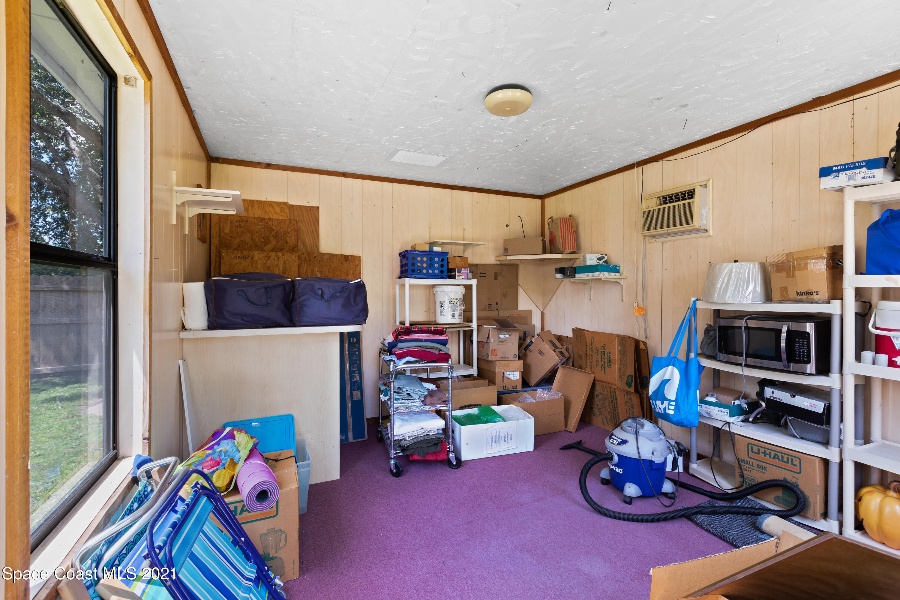 1410 Creel Road Northeast Palm Bay, FL 32905 - Photo 39 of 39 a children room with furniture and toys