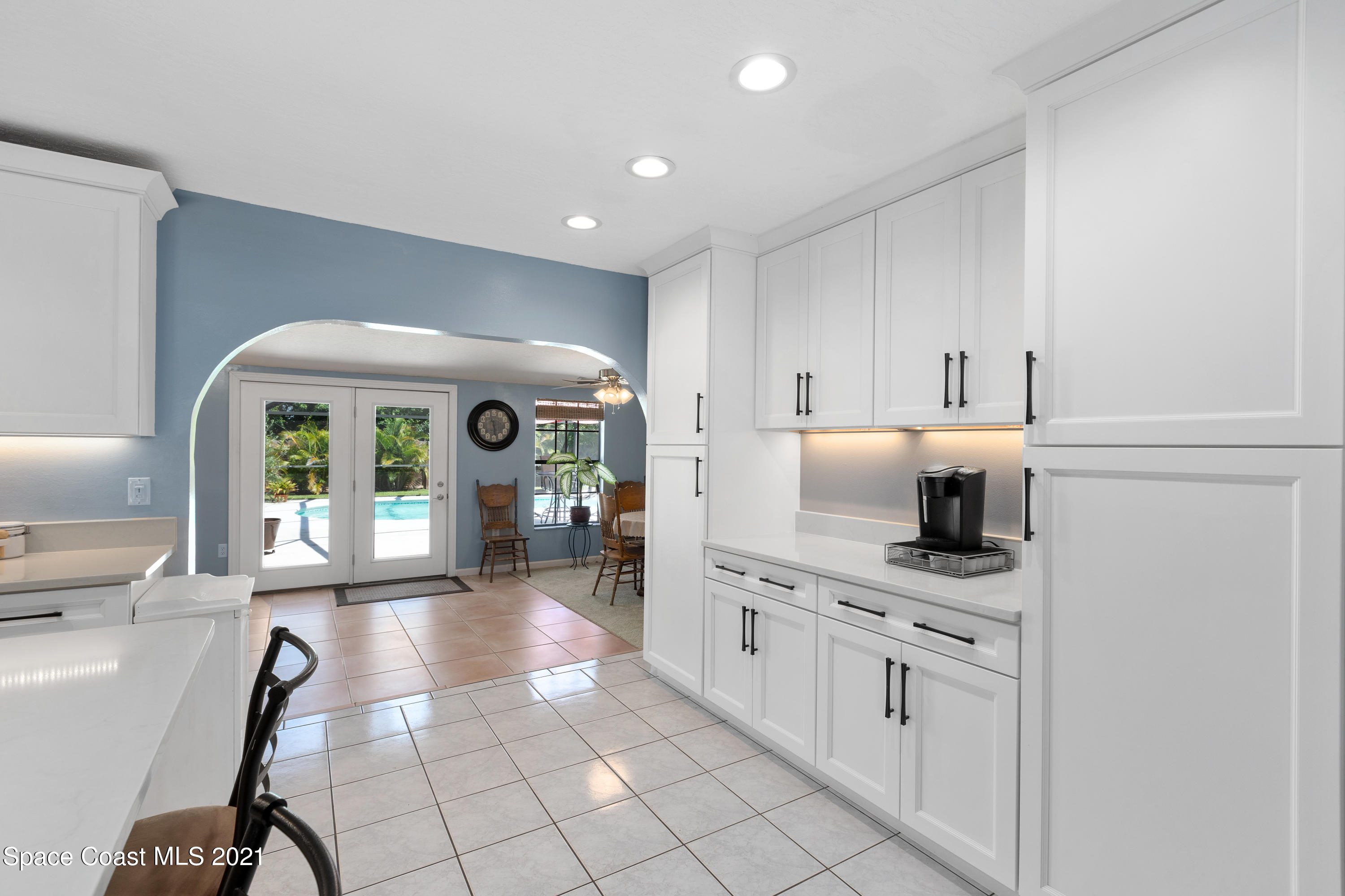 1410 Creel Road Northeast Palm Bay, FL 32905 - Photo 6 of 39 a very nice looking open dining room with kitchen island
