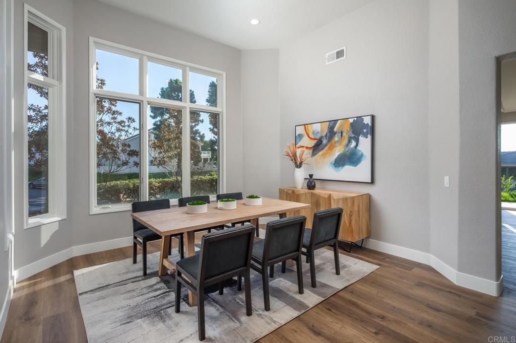 1808 Amalfi Drive Encinitas, CA 92024 - Photo 16 of 33 a view of a dining room with furniture wooden floor and a window