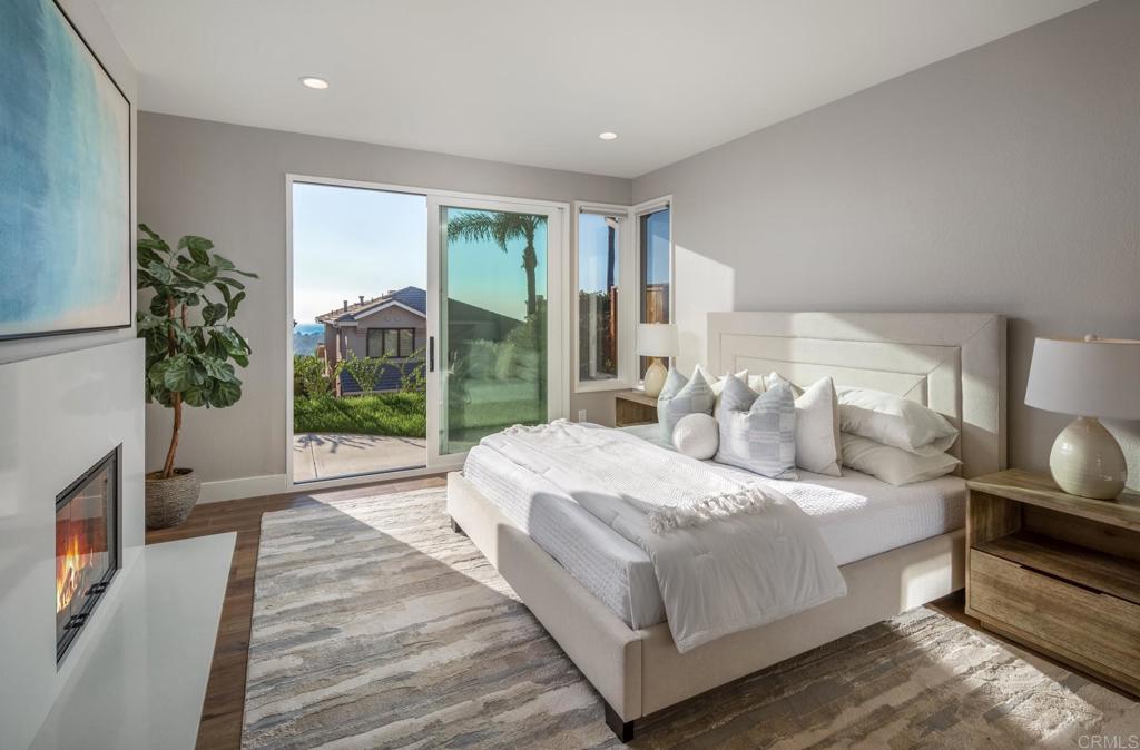 1808 Amalfi Drive Encinitas, CA 92024 - Photo 17 of 33 a bedroom with a bed and a large window