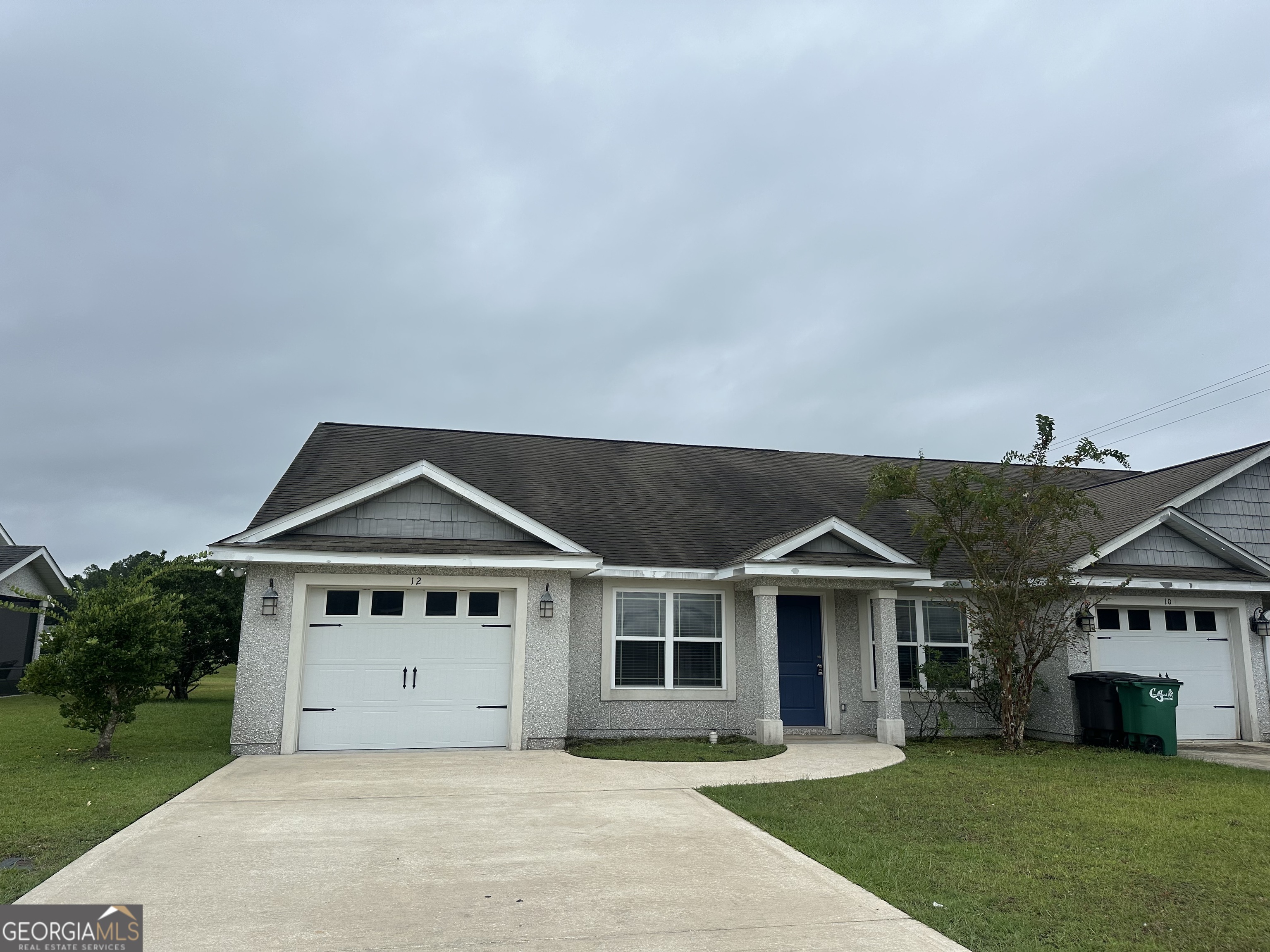 12 Fox Path St. Marys, GA 31558 - Photo 1 of 23 a front view of a house with a yard