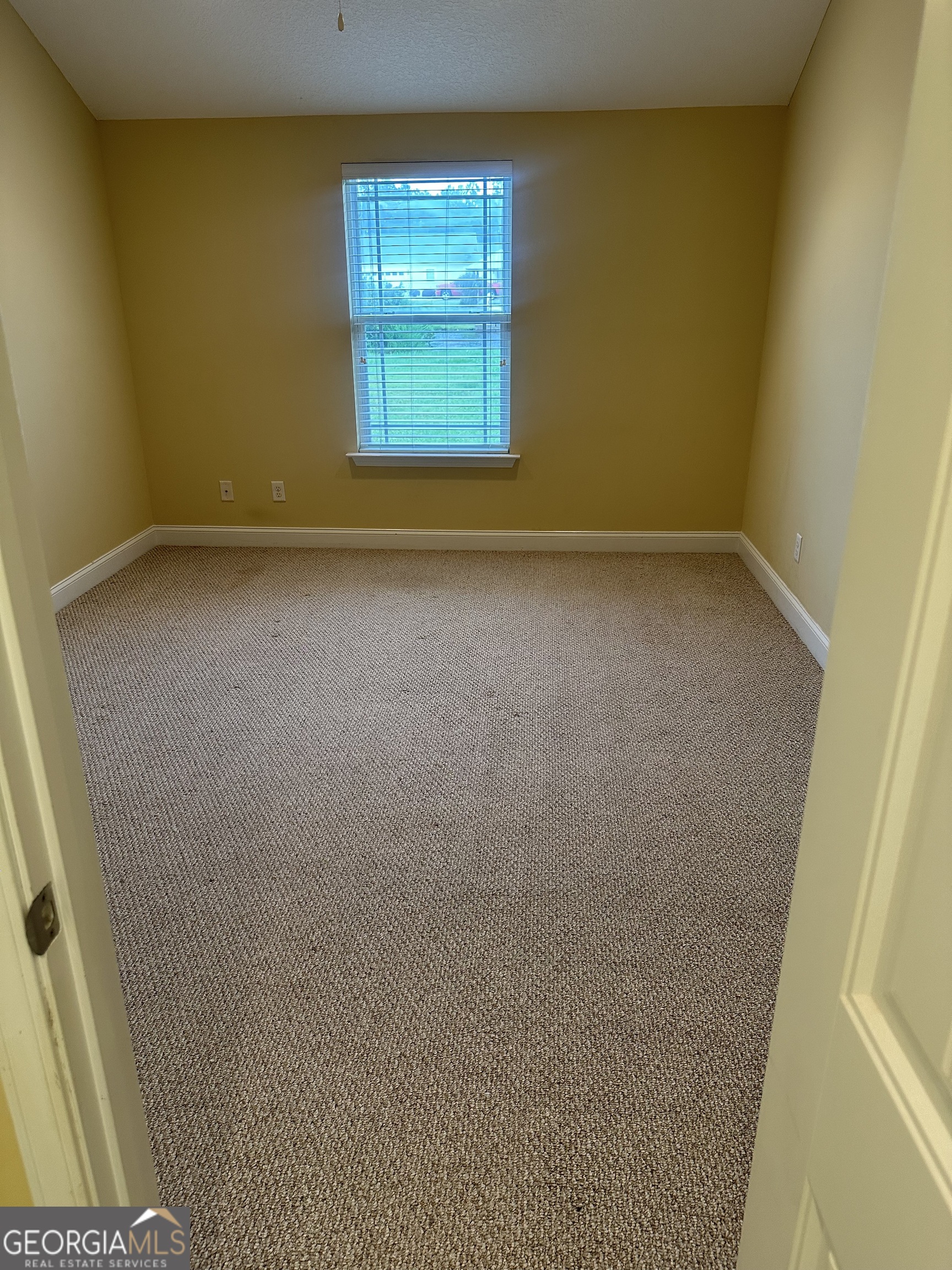 12 Fox Path St. Marys, GA 31558 - Photo 17 of 23 a view of an empty room with a window