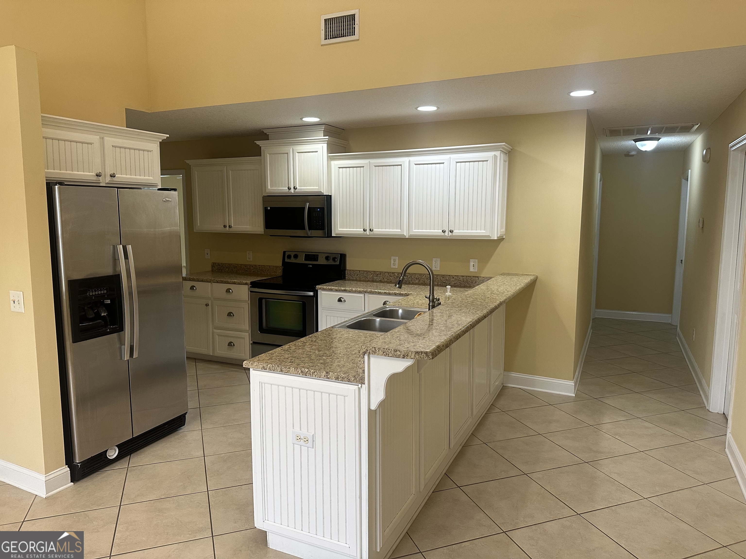12 Fox Path St. Marys, GA 31558 - Photo 5 of 23 a kitchen that has a sink cabinets and stainless steel appliances