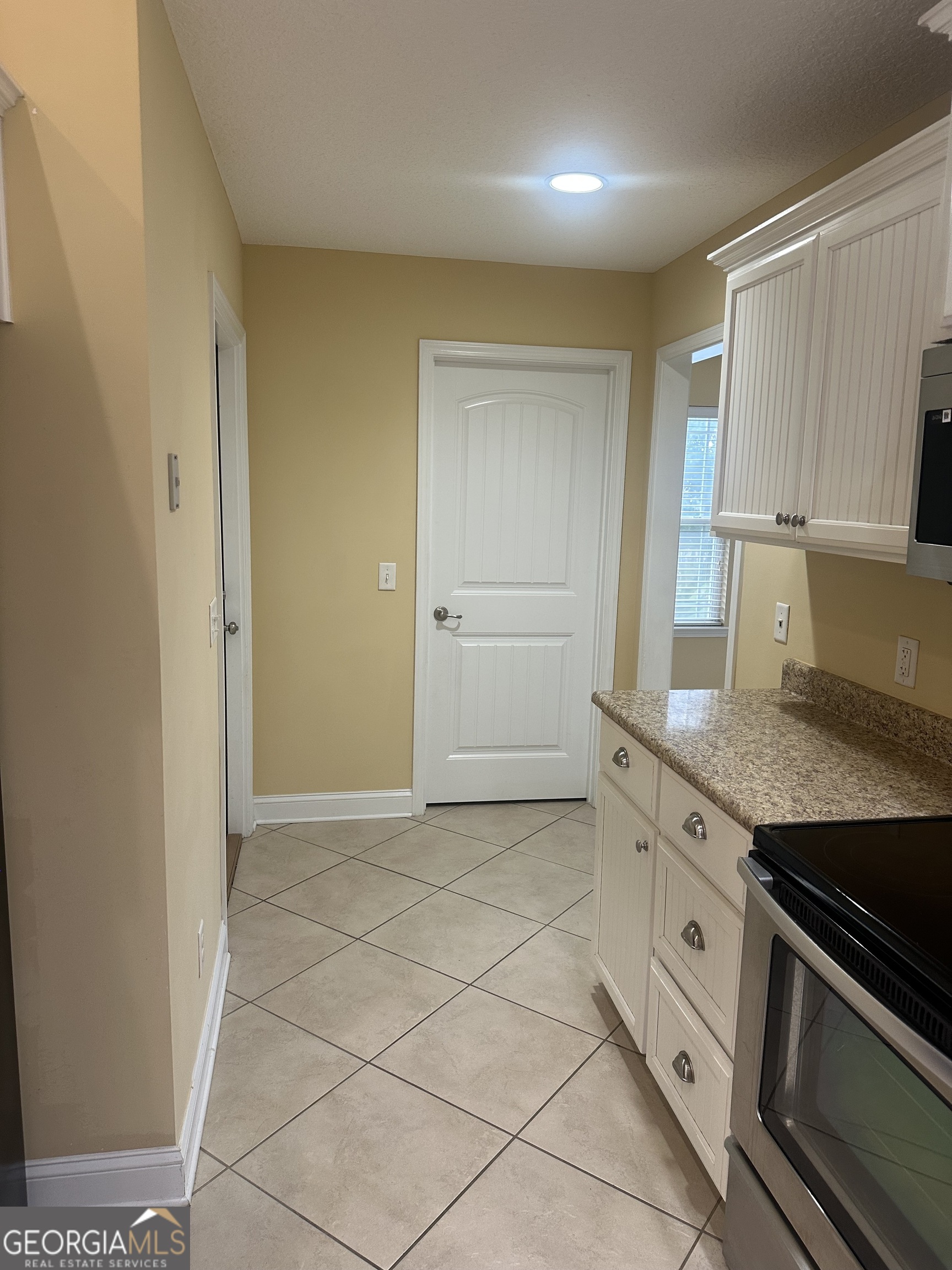 12 Fox Path St. Marys, GA 31558 - Photo 7 of 23 a kitchen with granite countertop a sink cabinets and stainless steel appliances