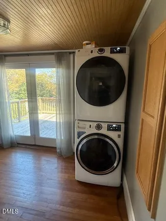 a view of a hallway with washer and dryer