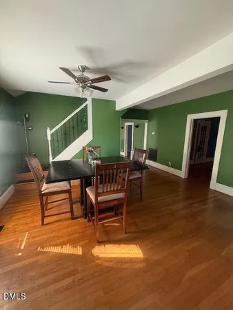 a outdoor space with lots of chairs and a table