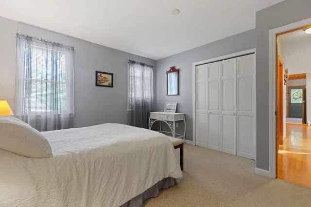 a bedroom with a bed and a table in it