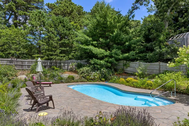 a view of a backyard with sitting area