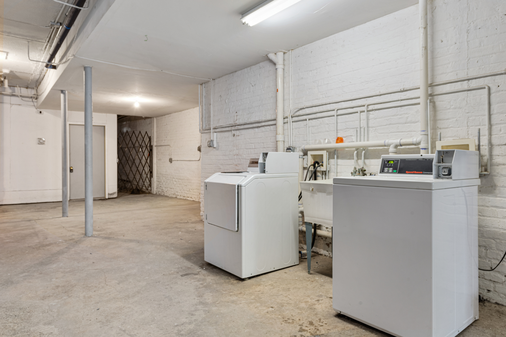 7010 South Clyde Avenue, Unit 3N Chicago, IL 60649 - Photo 13 of 19 a utility room with dryer and washer